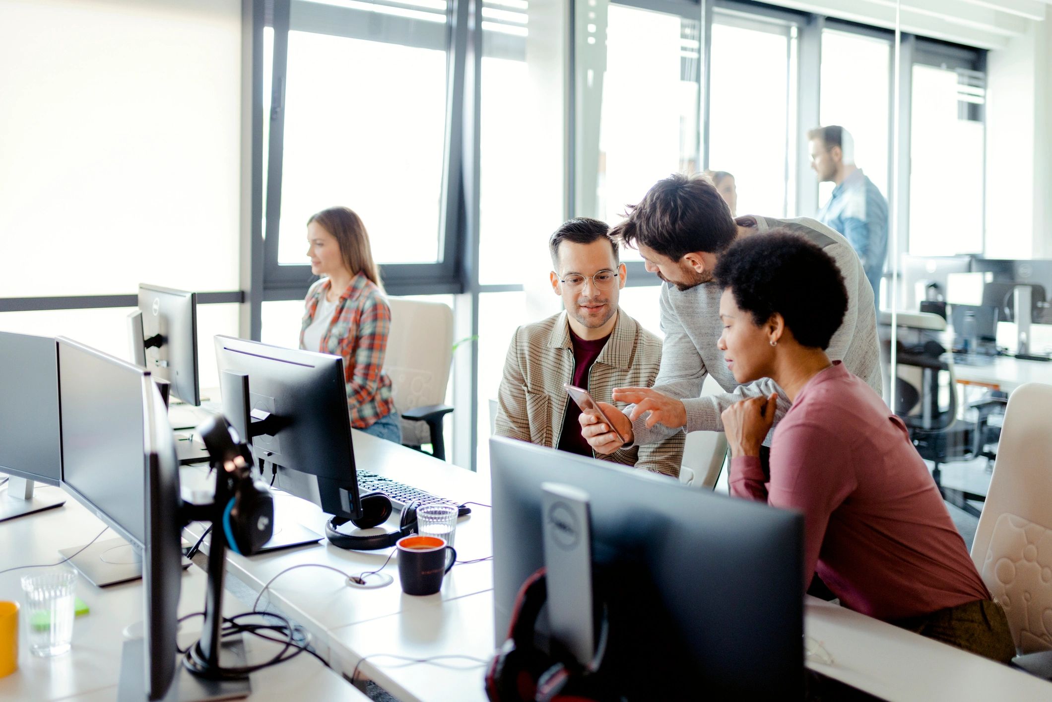 Software professionals collaborating in a modern office